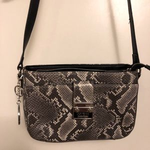 Guess snake pattern cross body purse.